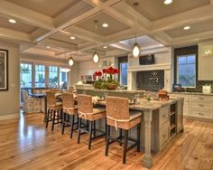 a large kitchen with an island in the middle