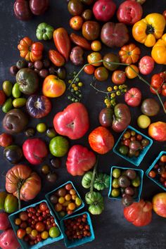 many different types of fruits and vegetables on a table