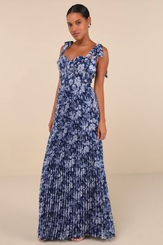 Everyone knows that you're a style icon, but the Lulus Illustrious Aura Navy Blue Floral Bustier Tie-Strap Maxi Dress will have them in awe all over again! A timeless floral print adorns lightly crinkled, airy woven fabric as it shapes a bustier-inspired bodice with a sweetheart neckline and seamed cups and detailing, supported by long straps that tie at the shoulders. The high, fitted waist top a flowy, pleated A-line skirt that falls to as sweeping maxi hem. Hidden back zipper/clasp. Fit: This Blue Dress With Adjustable Straps And Fitted Bodice, Blue Dress With Straps And Sweetheart Neckline, Blue Dresses With Sweetheart Neckline And Straps, Blue Sweetheart Neckline Dress With Straps, Blue Fitted Maxi Dress With Ruffled Straps, Blue Maxi Dress With Ruffled Straps For Party, Blue Dress With Adjustable Straps For Dress Down, Casual Blue Dresses With Adjustable Straps, Strapless Party Maxi Dress With Tie Straps