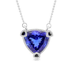 Sophisticated and romantic, this triangle cut violet tanzanite pendant will take her breath away. Crafted in 18K white gold, this one of a kind necklace features an outstanding tanzanite wrapped in a triangle shaped subtle embellished diamond halo, placed in a unique setting of three open pave-lined diamond triangle prongs holding the striking center stone for extra sparkle and detail. This radiant look is one she'll turn to often, everyday, and on special occasions. An Luxury Silver Tanzanite Necklace, Formal Tanzanite Diamond Cut Necklace, Trillion Cut Tanzanite White Gold Jewelry, Trillion Cut Tanzanite Jewelry In White Gold, White Gold Tanzanite Necklace For Formal Occasions, Formal Silver Tanzanite Necklaces, Formal White Gold Tanzanite Necklace, Formal Tanzanite Fine Jewelry Necklace, Formal Tanzanite Necklace Fine Jewelry