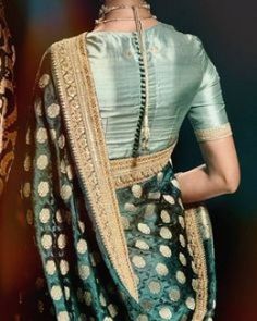 silk saree blouse with putli buttons down the centre of the blouse back Chania Choli, Sari Style, Sabyasachi Mukherjee, Wedding Trousseau, Feather Touch, Blouse Designs Catalogue, Blouse Ideas, Best Blouse Designs