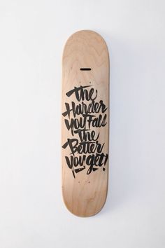 a wooden skateboard with the words'the harder you fall, the better you get'written on it