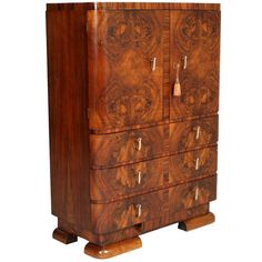 a wooden cabinet with drawers and handles