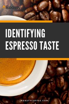 a cup of espresso sitting on top of coffee beans with the words identifying espresso taste