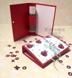 an open card with a ladybug design on it