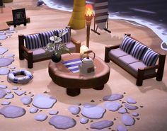 a living room filled with furniture on top of a sandy beach