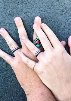 two people with matching rings on their fingers