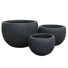 three cement planters sitting next to each other