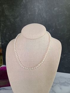 This is a vintage pearl beaded necklace with a 10K yellow gold clasp. Hallmarks: 10KT JCM Weighs: 18 grams 18" long, and each pearl measures 3/16" wide All measurements are approximate. Condition: Vintage condition. Normal wear associated age. Please see photos. Sold as is. Priced accordingly. Please look over carefully and inspect any and all photos. Our shop is committed to fully disclosing all items' conditions and history with as great of detail as possible. Please consider this when examini Classic Pearl White Beaded Necklace With Pearl Drop, Classic Beaded Pearl Necklaces With Pearl Charm, Classic Beaded Necklace With Pearl Charm, Classic White Beaded Necklaces, Classic White Beaded Necklace, Classic Pearl Necklaces With Polished Beads, Classic Pearl Necklace With Polished Beads, Classic Polished Pearl Necklace For Wedding, Classic Beaded Necklace With Pearl Pendant