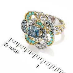 Gems en Vogue
18K Gold Accented
3.14ctw Topaz,
Turquoise & White
Zircon Flower Ring Luxury Turquoise Jewelry With Center Stone, Fine Jewelry Turquoise Blue Topaz, Turquoise Topaz Ring With Gemstone Accents, Elegant Turquoise Jewelry With Center Stone, Luxury Turquoise Jewelry For Anniversary, Elegant Turquoise Jewelry With Accent Stones, Turquoise Topaz Jewelry With Gemstone Accents, Luxury Turquoise Topaz Ring For Anniversary, Vogue Jewelry