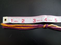 a measuring tape that has been used to measure the length of a piece of fabric