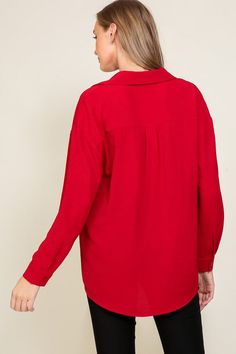 The Brooklyn Button Down Top is the perfect combination of comfort and fashion. The airy and breathable Airflow fabric ensures you stay cool, while the oversized design, long-sleeves, and v-neck complete the look. It's the perfect top for making a stylish and sophisticated statement! Red V-neck Shirt For Fall, Versatile Oversized V-neck Blouse, Oversized Versatile V-neck Blouse, Red Relaxed Fit Long Sleeve Blouse, Oversized Red Fall Blouse, Red V-neck Shirt With Relaxed Fit, Oversized Red Long Sleeve Shirt, Red Oversized Chic Tops, Oversized Red Button-up Blouse