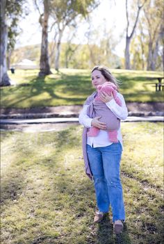 a woman holding a baby in her arms