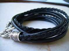 Time to get your Nero on with this 5 Strand Black Leather Bracelet. Wrap it around your wrist twice, toggle and go...A great addition to any jewelry collection. Worn alone, layered or stacked....show them your "Inner Rebel". Materials: Lead and Nickel Free - Aged Silver Toned Alloy Metal Components, Fine Grade 5mm Braided and 3mm Round Imported Leather Cords. Each piece comes with a brand hang tag and a black drawstring pouch. Size: Available to fit a firm wrist measurement of 6/6.5/7/7.5/8 inch Leather Bracelets Women, Belt Holster, Double Wrap Bracelet, Black Leather Bracelet, Leather Bracelets, Black Bracelets, Unique Jewelry Designs, Drawstring Pouch, Bracelets For Women