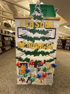 a sign in the middle of a library that says season's readings on it