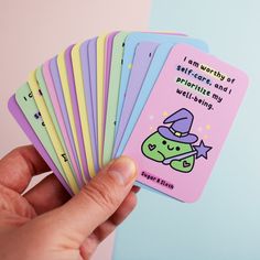 a hand holding six cards with the words i am worthy of self - care and promoting my well being