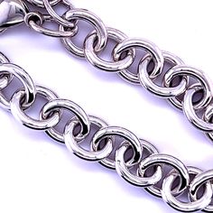 a silver chain is shown on a white background