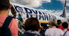 many people are boarding an airplane on the tarmac with stairs leading up to it