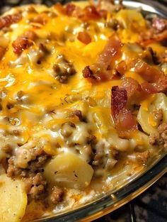 a casserole dish with potatoes, meat and cheese