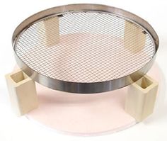 a round metal table with two square bases