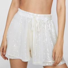 Beautiful Shorts! Bought For Bachelorette Party But Went With Something Else. Perfect For Your Bachelorette Party And Bridal Needs! Sparkles By The Sea. Team With A Pair Of Strappy Sandals, And Layer Over Your Favorite Bikini. Details: High Waisted Design. Flippy Style. Elasticized Waistband. Tie Detail. Semi-Sheer Overlay. Sequin Embellishments. Opaque Woven Under Layer. Short Length. Relaxed Fit. Condition: Nwt, Never Worn Follow Me On Instagram, Tiktok, And Pinterest! @Hannaholiviacrisp *** R Summer Pajama Shorts For Night Out, Chic White Summer Pajama Shorts, White Fitted Party Shorts, Chic Sequined Shorts For Summer, White Summer Bottoms For Party, White Summer Bottoms For Night Out, White Party Shorts, White Summer Party Shorts, White Shorts For Summer Parties