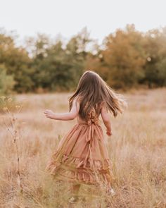 Celebrate the bond between mother and daughter with our fan favorite Nellie Ruffle Maxi Dress in rich Mocha! Perfectly designed for those cherished, twinning moments, this dress offers a blend of elegance, comfort, and a dash of playful sophistication.Note: Nellie's are made with modesty in mind! Infant and toddler sizes (0/3 - 5T) have an open back. The Tween and Mom sizes (6T - XXL) are made with more coverage. Key Features: Dreamy Ruffle Detailing: Adorned with soft, cascading ruffles, this d Mommy And Me Dresses, Ruffle Maxi Dress, Cascading Ruffles, Mocha Color, Photoshoot Dress, Photo Outfit, Mother And Daughter, Ruffled Maxi Dress, Style And Grace