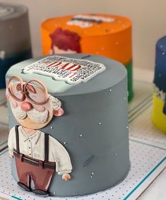 there is a cake decorated with an image of a man wearing glasses and suspenders