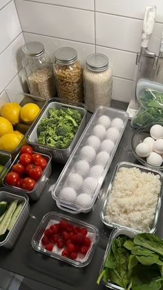 an assortment of food is displayed on a counter