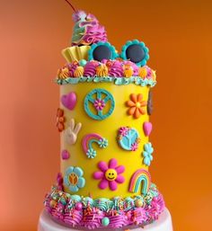 a brightly colored cake with lots of decorations on it