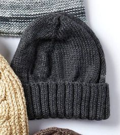 three knitted hats sitting next to each other