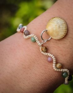 This handwoven bracelet uses Indian Agate and Moss Agate beads, combined with a handpicked seashell from the Cornish shores. While I have coated the seashell in resin, to reinforce it and give it a subtle shine, I do recommend not putting it in hot water, or putting too much pressure on it as it is a natural product. All clasps and extender chains are sterling silver. Any group photos show other items sold separately in my store. Silver Knot Bracelet, Too Much Pressure, Seashell Bracelet, Indian Agate, Woven Bracelet, Knot Bracelet, Agate Bracelet, Woven Bracelets, Pearl Shell