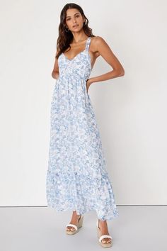 Kick off your happily ever after with the Lulus My Love Story White Floral Print Tie-Back Maxi Dress! Woven chiffon, decorated with Swiss dots and a lovely blue and purple floral print, shapes a seamed fitted bodice and tank straps that thread through loops and tie at the back. High waist tops the flowy maxi skirt that ends with a ruffled drop seam. Hidden side zipper/clasp. My Love Story, Flowy Maxi Skirt, Flowy Maxi Skirts, Purple Floral Print, Baby Shower Dresses, Shower Dresses, Chiffon Maxi, Chiffon Maxi Dress, Dress With Tie