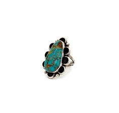 Vintage Native American Turquoise Ring, Size 5.25 - Express your appreciation for the Earth and its natural beauty with this stunning ring featuring a unique, high-quality piece of turquoise. The turquoise is set securely in a bezel and surrounded by intricate metalwork that resembles a beautiful flower. This ring also has a comfortable and durable double half-round split band. US Ring Size: 5.25 Stone: Turquoise Setting: 1.25" L x .75"W Ring Band: Split Shank Metal: Sterling Silver Artisan Signed: JM Weight: 8.2 Grams This listing is for (1) Ring only Explore our carefully curated selection of timeless Vintage Rings here. Discover the entire 'Silver Raven' Vintage Collection for yourself. Adjustable Turquoise Fine Jewelry Ring, Adjustable Fine Jewelry Turquoise Ring, Turquoise Multi-stone Ring Fine Jewelry, Fine Jewelry Turquoise Multi-stone Ring, Native American Turquoise Ring, Raven Jewelry, A Beautiful Flower, Native American Turquoise, American Turquoise