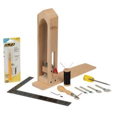 a wooden craft kit with tools and supplies