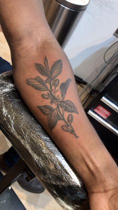 a person with a tattoo on their arm