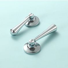 two chrome handles on a blue background