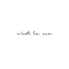 the word est la vie is written in cursive handwriting on a white background