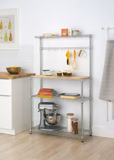 a kitchen with two shelving units and various cooking utensils