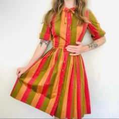 True Vintage Retro Rainbow Dress 60s-70s Fit & Flare Collared Orange Pink Green Stripe Size: 7/8 Vintage, Please See Measurements. Listing As Xxs. Bust 17” Flat (34” Around), Waist 11 3/4” Flat (23.5” Around), Approximately 37” Long. Condition: Guc/ Missing Original Belt. In Very Good Condition For Age. Details: Collared Dress With Bow At Neck, Buttons All The Way Down, Short Sleeve, Striped, Green, Brownish Orange, And Pink. Bow At Neck Is Removable, Midi/Knee Length, Short Sleeve. Both The Rn Number And The Pinking Sheer Cuts To The Seams Lead Me To Believe This Dress Is Well Over 60 Years Old! Please Excuse My Awkward Hand - This Dress Is Way Too Tiny For My Tummy! Retro A-line Vintage Dress For Fall, Retro Mid-length Fitted Dress, Red Vintage Short Sleeve Dress For Spring, Red Short Sleeve Vintage Dress For Spring, Red 1950s Style Spring Dress, Red Retro Dress For Spring, Retro Red Knee-length Midi Dress, Retro Red Dress For Spring, Red Retro Knee-length Midi Dress