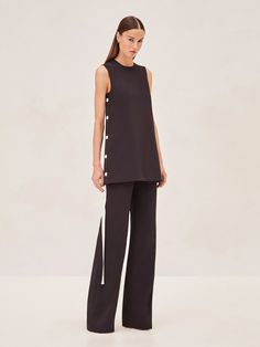 Elevate your ensemble with the Roks Pants, where tailored sophistication meets modern flair. These pants are cut to perfection, offering a flattering high-rise waist and a fluid wide-leg silhouette that promises to streamline any look. The sleek side stripe detail adds a contemporary edge. Versatile in design, they can be seamlessly paired with the structured elegance of the Morison Top or the relaxed refinement of the Libra Dress. Model wears XS. Libra Dress, Joah Brown, Right To Privacy, Sleeveless Shift Dress, Side Stripe, Straight Cut, In Design, Model Measurements, Bottoms Pants