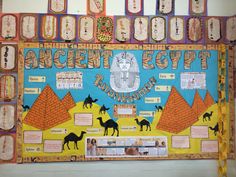 an ancient egypt bulletin board with camels and pyramids