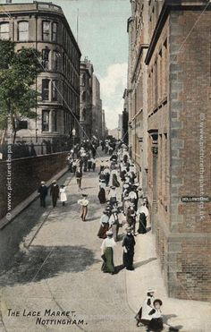 an old photo of people walking down the street