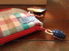 Red zipper. Quilting, Patchwork eye purse, Sashiko embroidery purse in textile Japanese fabrics and wool ,hand sewn.