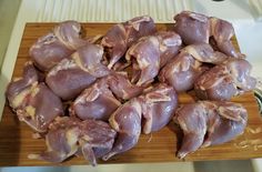 raw chicken pieces on a cutting board ready to be cooked