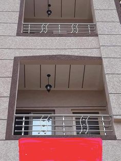 two balconies on the side of a building