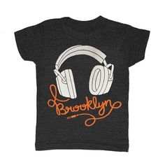 GNOME ENTERPRISES | Handprinted in Brooklyn, NYOur Kid's Brooklyn Headphones t-shirt is printed by hand on a high quality, sweatshop-free American Apparel super soft tri-blend tee.- Unisex kids (sized by even numbers) - Sizing corresponds approximately to age - 50% poly | 25% rayon | 25% cotton - Color: triblend charcoal*When ordering our kid's tees, you may prefer to select one size up as they run very true to size.*Sizing corresponds approximately to age.Please take a moment to review our size Urban Fitted T-shirt With Letter Print, Music-themed T-shirt With Band Logo For Streetwear, Music-themed Band Logo T-shirt For Streetwear, Music-themed Fitted Cotton T-shirt, Fitted Cotton Music-themed T-shirt, Unisex Hip Hop T-shirt With Letter Print, Unisex Music-themed Screen Print Top, Unisex Music-themed Tops With Screen Print, Music-themed Graphic T-shirt For Streetwear