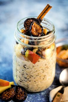 a glass jar filled with food on top of a table