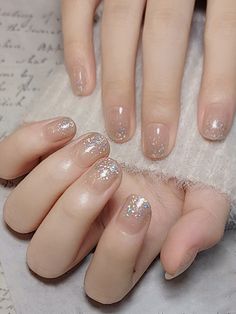 Gold French Manicure Nails, Nye Nails Short, Neutral Nails Glitter Accent, Cream And Gold Glitter Nails, Neutral Pink Sparkly Nails, Neutral Gold Sparkle Nails, Taupe Shimmer Nails, Clear Gel Nails, Nail Design Glitter