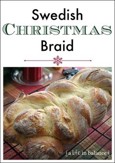 a loaf of swedish christmas bread sitting on top of a cooling rack with text overlay