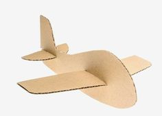 an airplane made out of cardboard on a white background